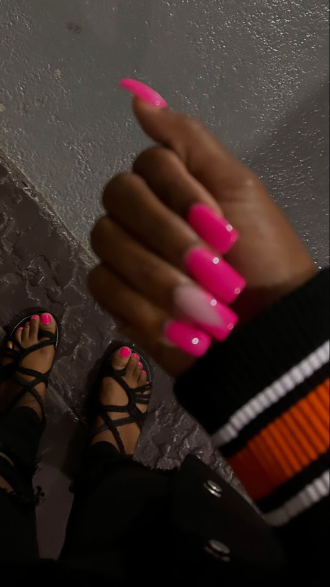 Chic Vibrant Pink Ombre Nail Design with Rhinestone Accents.