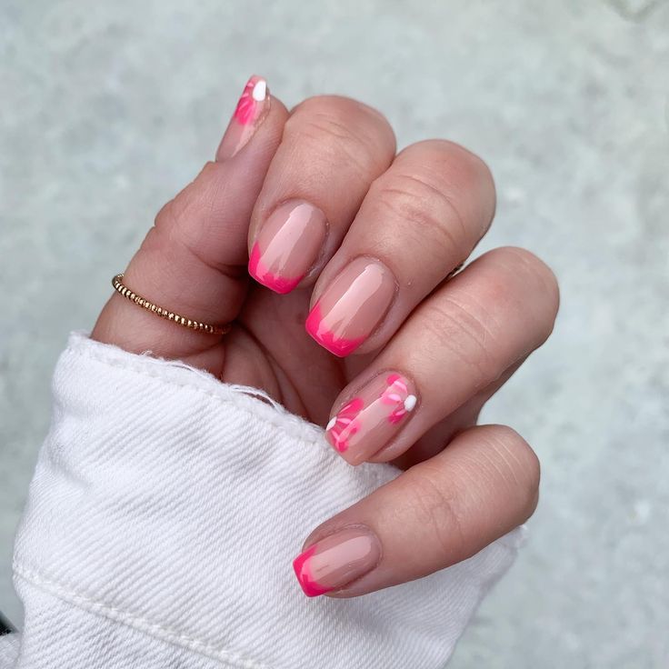 Modern Nude Nail Design with Playful Pink Tips and Abstract Accents