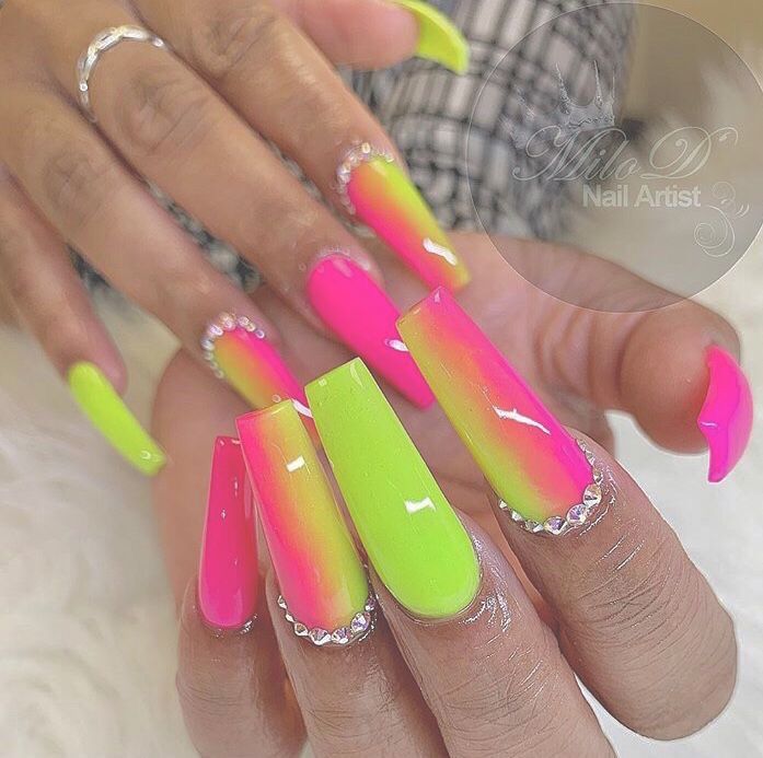 Bold Neon Gradient Nail Design with Rhinestone Accents for a Vibrant and Playful Look.