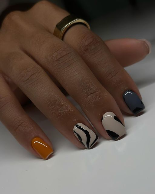 Trendy Vibrant Nail Design with Bold Colors and Elegant Abstract Patterns