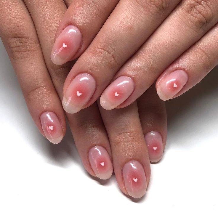 Whimsical Elegant Pink Gradient Nail Design with Tiny White Hearts.