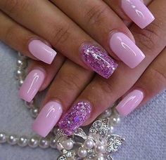 Chic Soft Pink Nail Design with Dazzling Glitter Accent for Sophisticated Elegance.