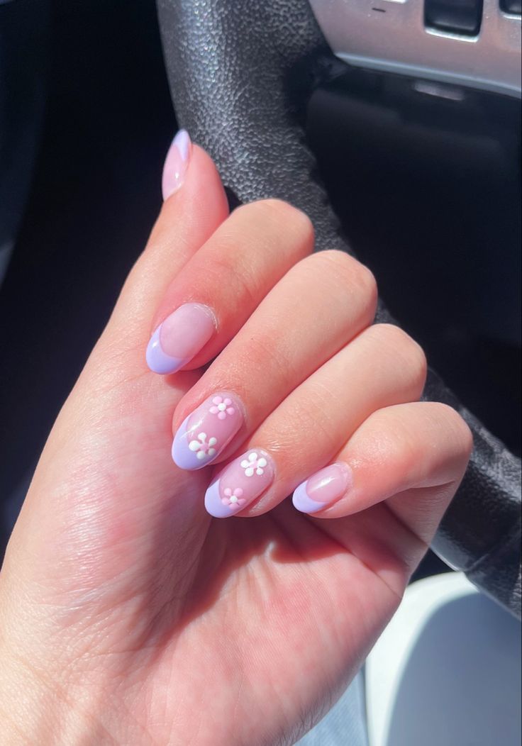 Delicate Lavender and Light Blue Floral Nail Design for a Whimsical Spring Aesthetic.