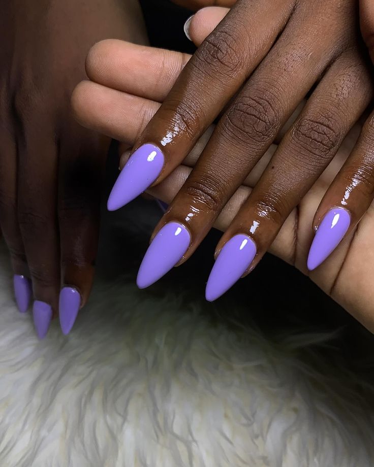 Chic Lavender Almond-Shaped Nails: A Contemporary Manicure for Every Occasion.