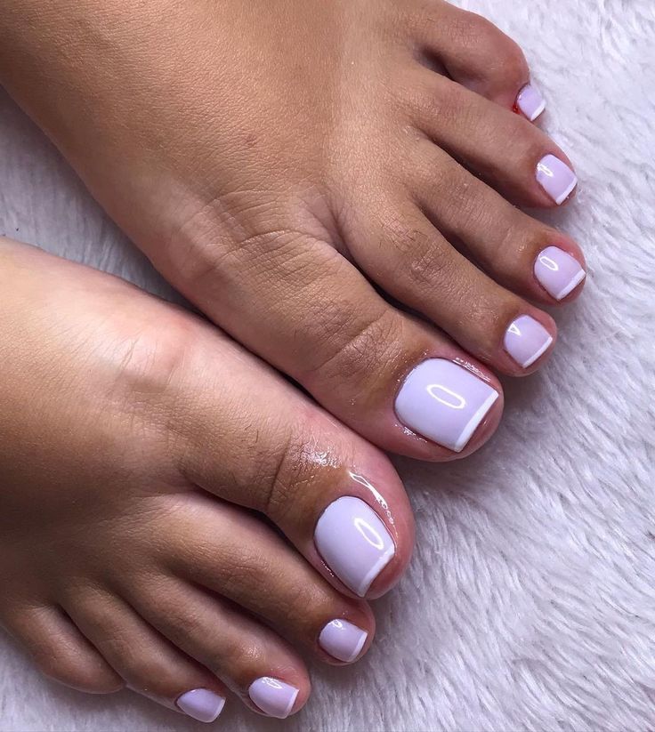 Elegant Soft Lavender Pedicure with Glossy Finish and Stylish White Tips