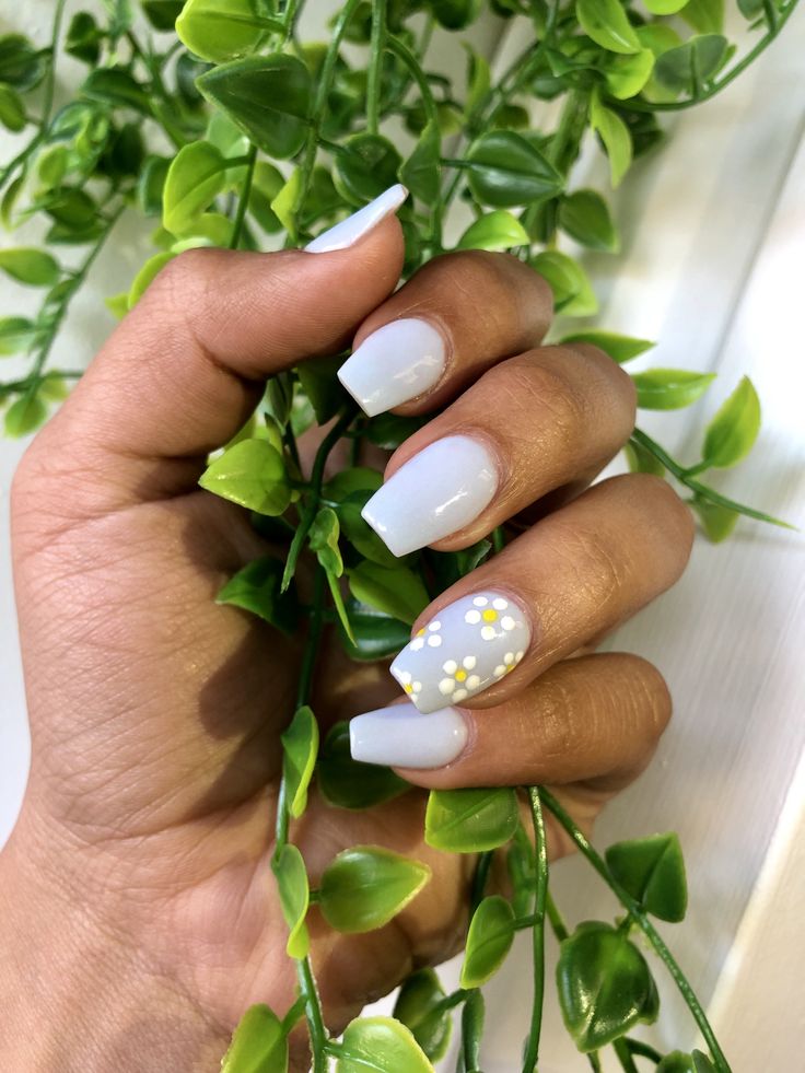 Chic Spring-Inspired Nail Design with Soft Pastel Blue and Playful Dot Accents.