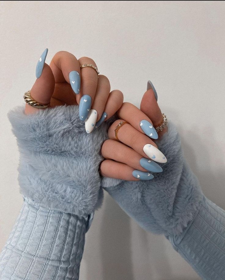 Chic Winter Nail Design: Soothing Blue and White Almond-Shaped Elegance