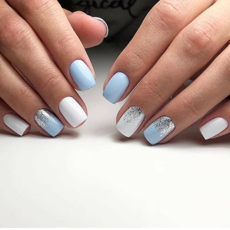 Elegant Pastel Nail Design with Blue, White, and Glitter Accents for Any Occasion.