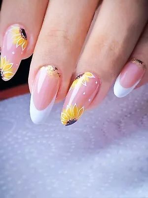 Elegant Soft Pink Floral Nail Design with Sunflowers and French Tips.