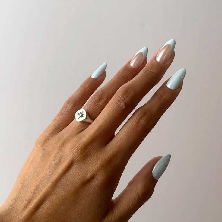 Chic Pastel Nail Design with Elongated Almond Tips and Minimalist Aesthetic.