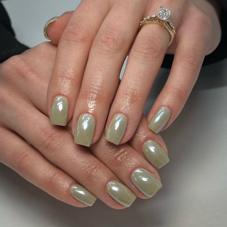 Elegant Glossy Green Nail Design: A Modern Take on Classic Style.