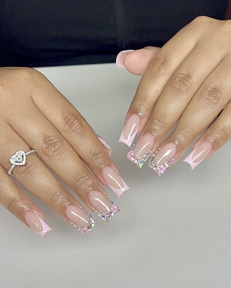 Elegant French Tips: Delicate Pink Base with Glamorous Rhinestone Accents