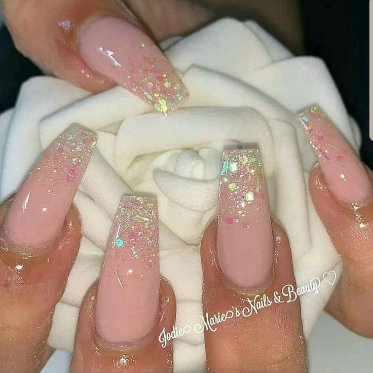 Elegant Long Square Acrylic Nails with Soft Nude Base and Glitter Gradient Accents.