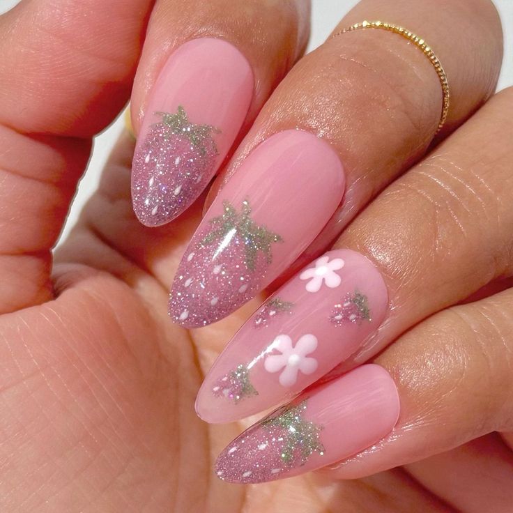 Elegant Soft Pink Nail Design with Glitter Accents and Whimsical Motifs