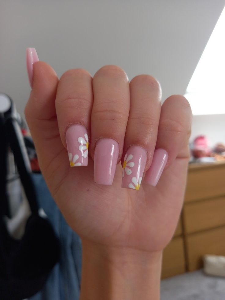 Soft Feminine Pastel Pink Nails with Floral Designs for Spring/Summer Elegance