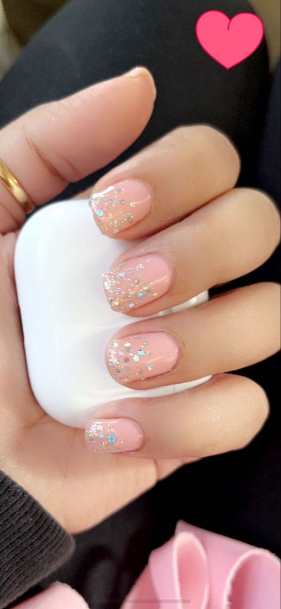 Elegant Nude Nails with Playful Sparkle for Any Occasion