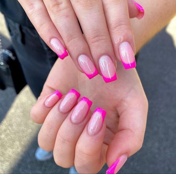 Neon Pink French Tip Nail Design: Bold and Playful with Shimmering Nude Base.