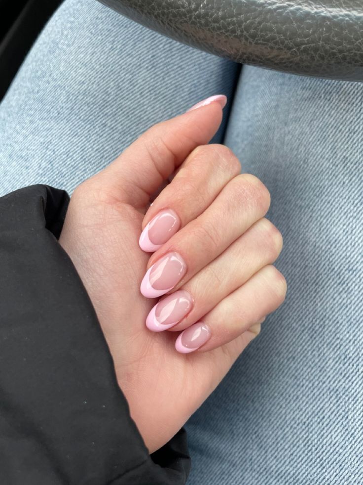 Chic Almond-Shaped Nail Design in Soft Pink with Glossy Finish: A Modern Take on Classic French Manicure.