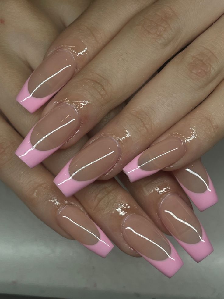 Chic Nude and Soft Pink Long Acrylic Nails: A Modern French Manicure with High-Gloss Elegance.