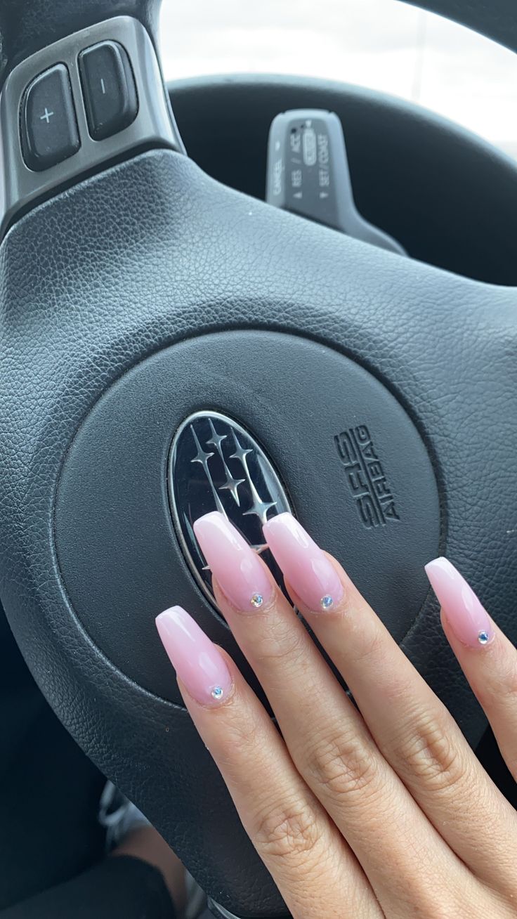 Elegant Pink French Tip Nails with Gemstones for a Chic, Sophisticated Look