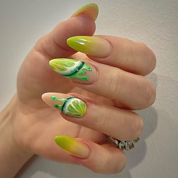 Vibrant Lemon Ombre Nail Design with Hand-Painted Accents and Elegant Almond Shape.