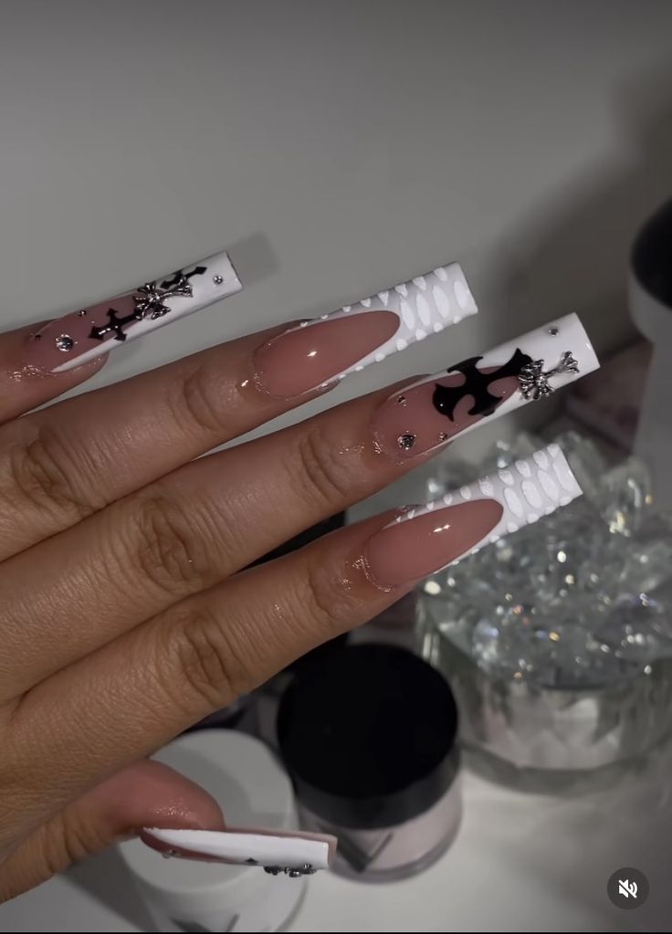 Sophisticated Nude and White Nail Design with Intricate Patterns and Sparkling Accents