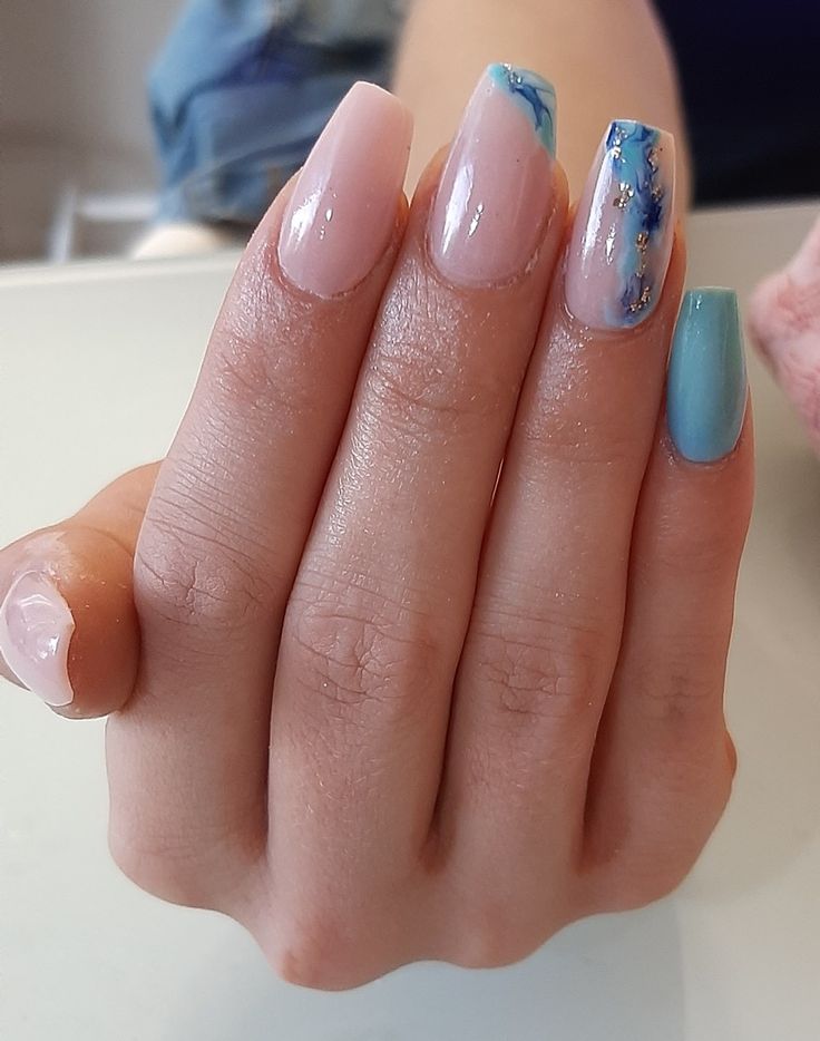 Chic Pastel Nail Design with Unique Artistic Patterns and Textures