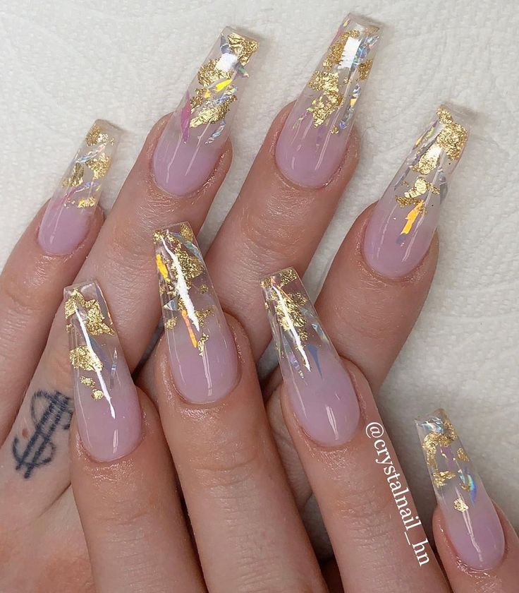 Luxurious Nude Nail Design with Gold Leaf Accents for Glamorous Style.