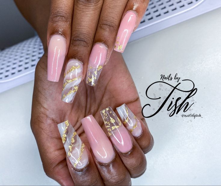 Chic Nail Design with Soft Pink, Clear Accents, and Glam Golden Foil Geometric Patterns.