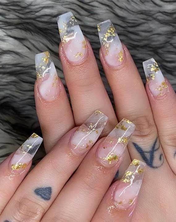 Chic Ombre Nail Design with Gold Flakes for Elegant Occasions.