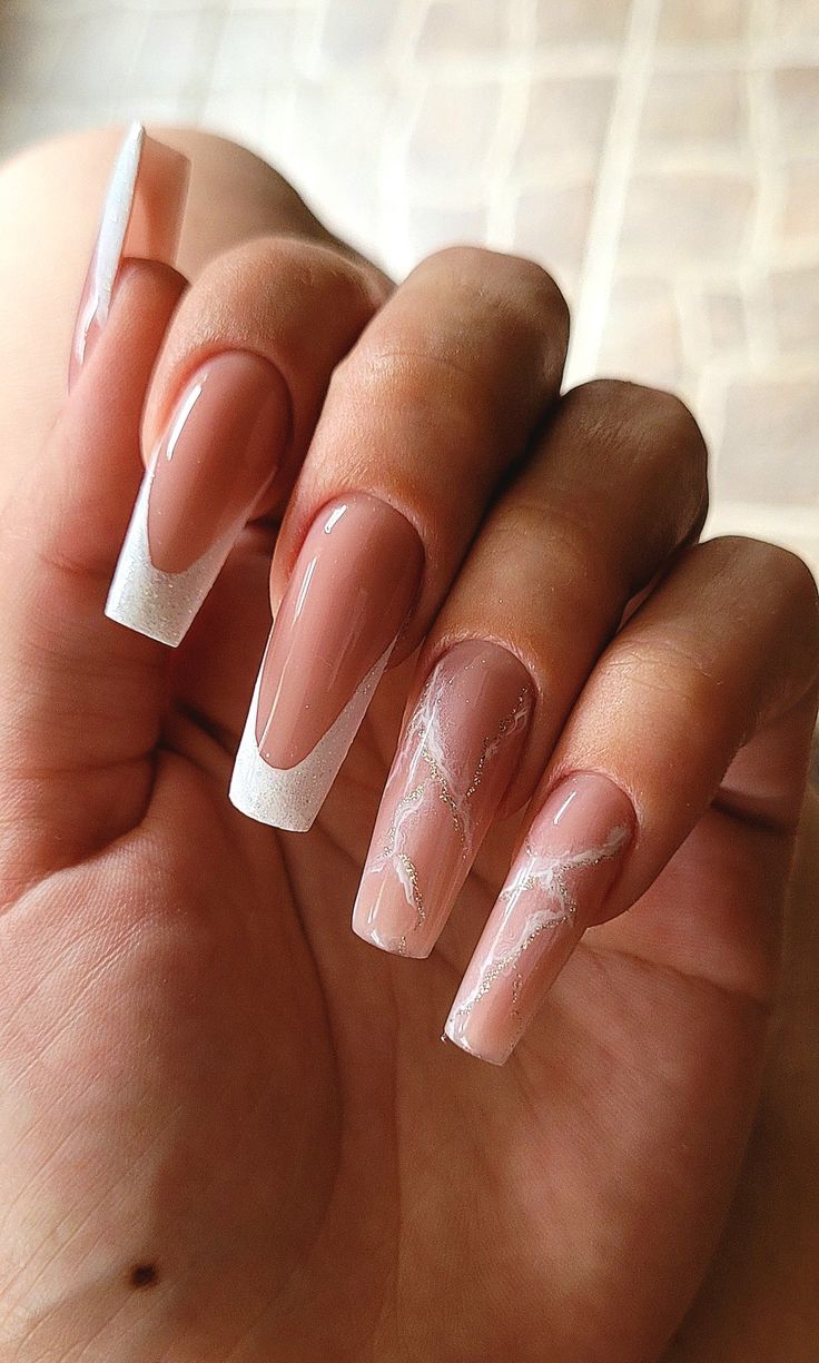 Elegant Almond-Shaped Nude and White Nail Design with Marbled Accents.