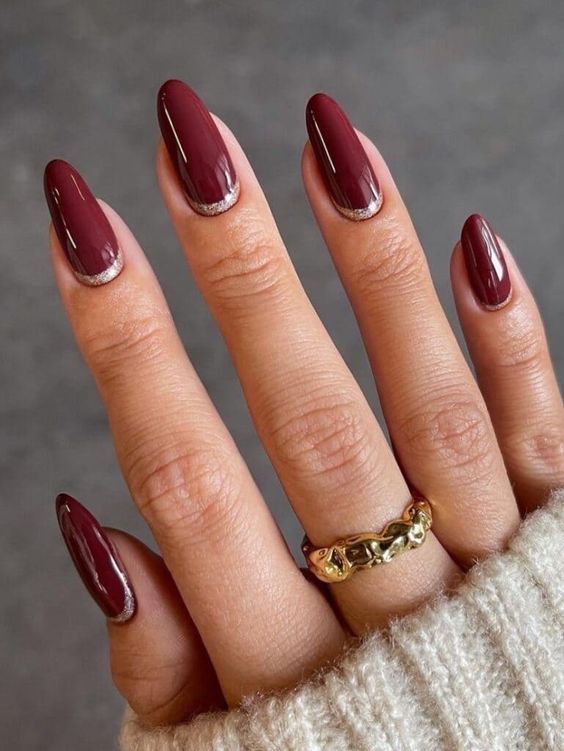 Sleek Burgundy Almond Nails with Silver Tips for Elegant Sophistication.