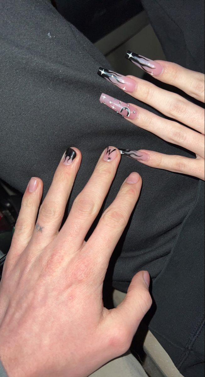 Trendy Nail Design: Elegant Long Shapes with Intricate Patterns and Bold Color Contrast