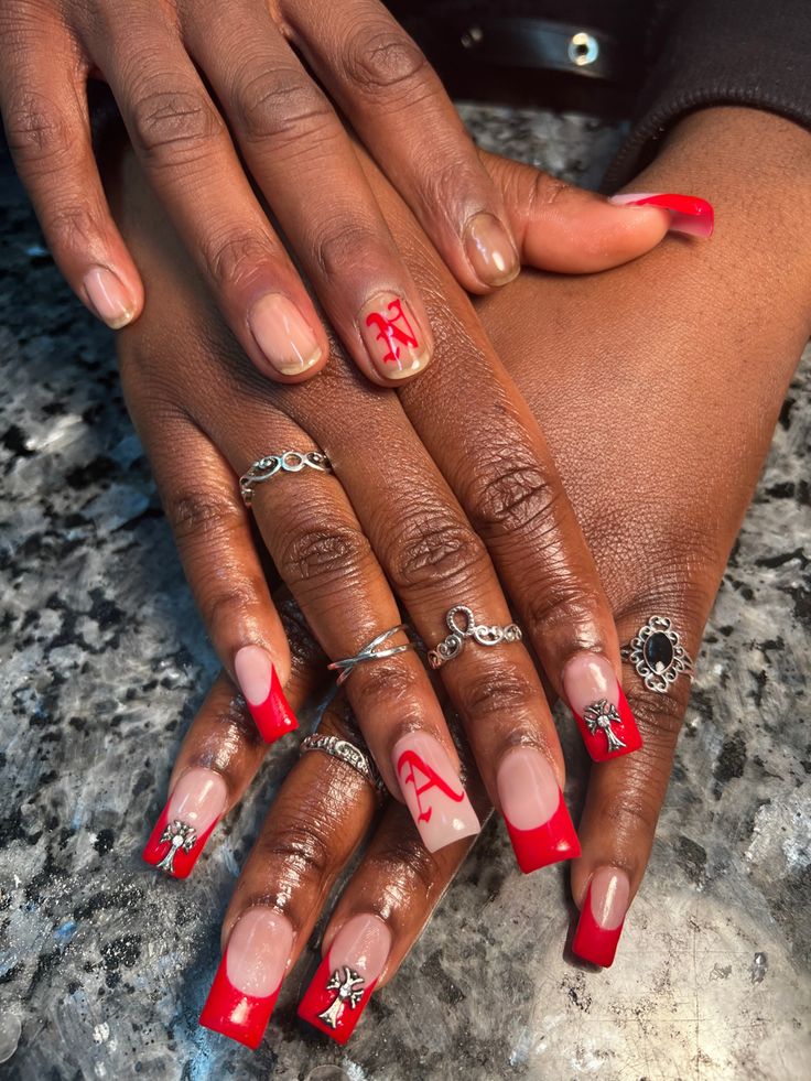 Elegant Bold Red and Nude Nail Design with Intricate Embellishments for Special Occasions