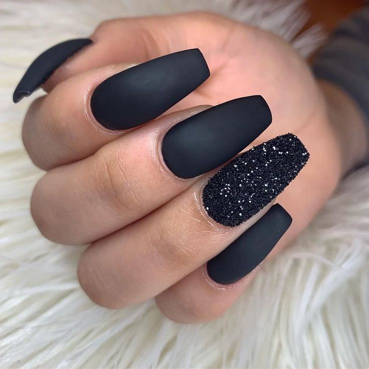 Elegant Matte Black Nail Design with Glitter Accent for a Sophisticated Edge.