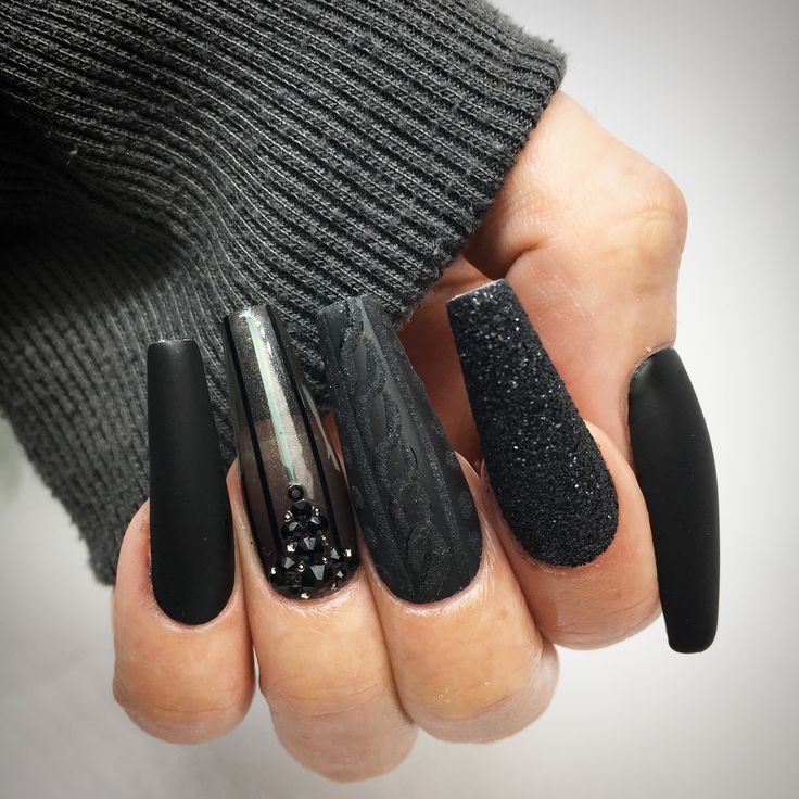 Chic Black Nail Design with Textured Elegance and Sparkling Accents