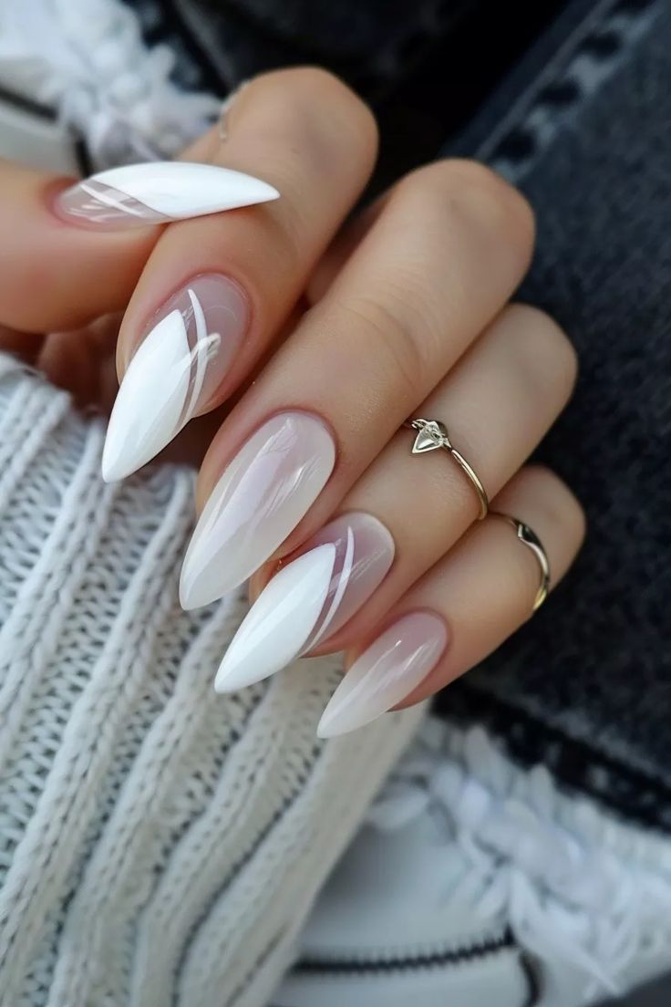 Sophisticated Sharp Nail Design with Glossy White and Subtle Nude Tones.