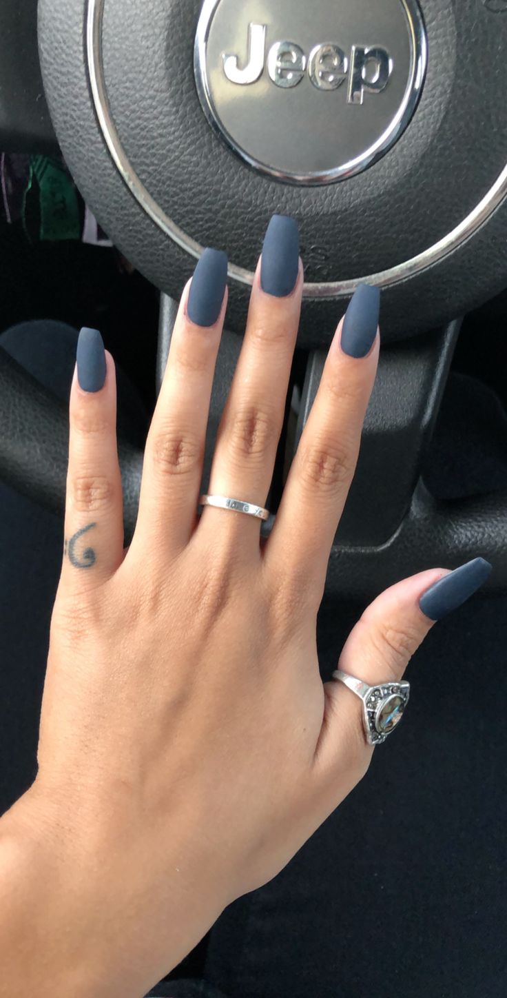 Elegant Matte Navy Stiletto Nails with Silver Accents.