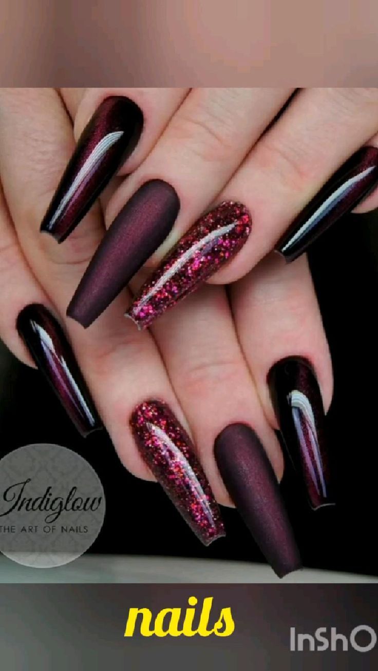 Bold and Sophisticated Nail Design with Deep Burgundy, Glossy Black, and Sparkling Glitter Accents.