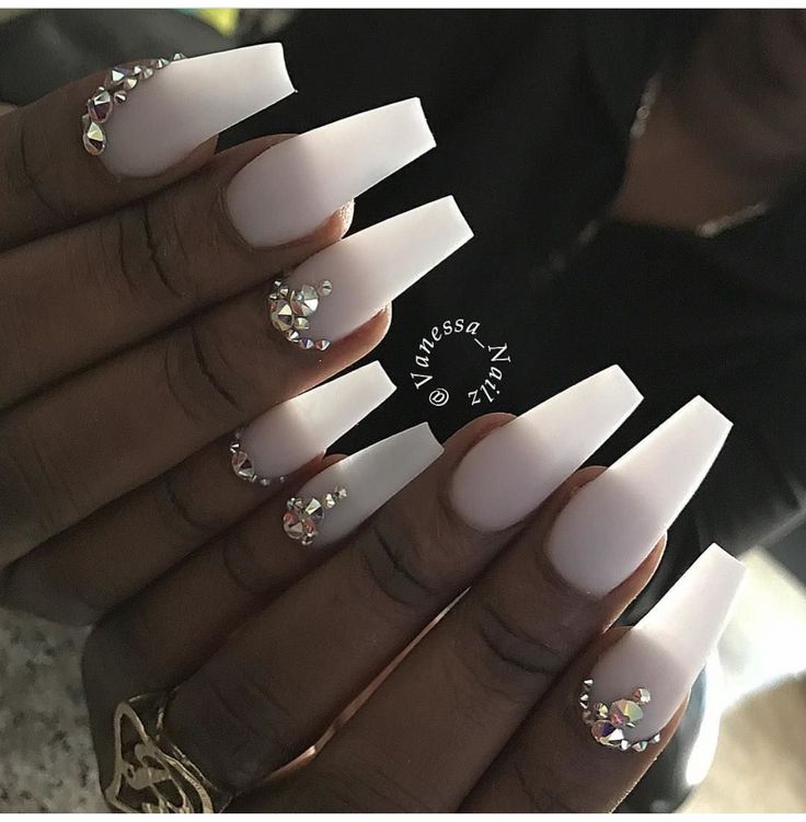 Elegant Matte Long Acrylic Nails with Intricate Rhinestone Accents for Glamorous Occasions.