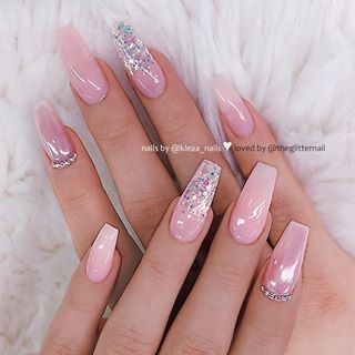 Sophisticated Squared Nail Design with Soft Pink Hues and Glamorous Embellishments.