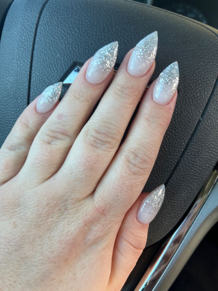 Sophisticated Stiletto Nail Design with Soft Pink and Shimmering Silver Gradient.