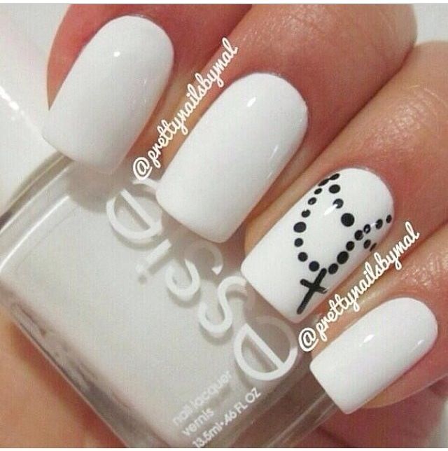 Sophisticated Elegant White Nail Design with Artistic Rosary Accent.