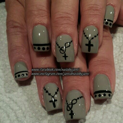 Elegant Gray Nail Design with Intricate Black Crosses and Beaded Chains for a Unique, Spiritual Touch.