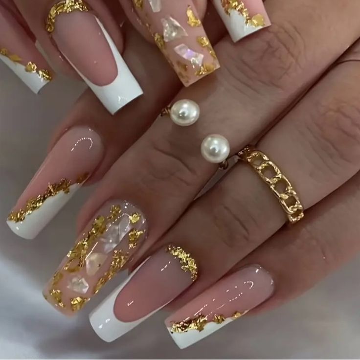 Sophisticated Nail Design: Nude Base with White Tips, Gold Flakes, and Opalescent Accents.