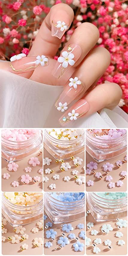 Elegant Floral Nail Design with White Flowers, Gold Accents, and Pastel Embellishments