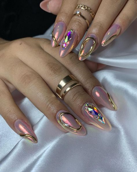 Sophisticated Glossy Pink Nail Design with Glamorous Golden Accents and Geometric Rhinestones.