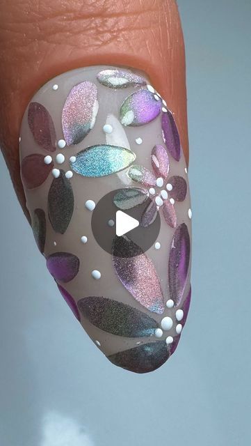 Vibrant Floral Nail Design with Holographic Accents and Elegant White Dots.