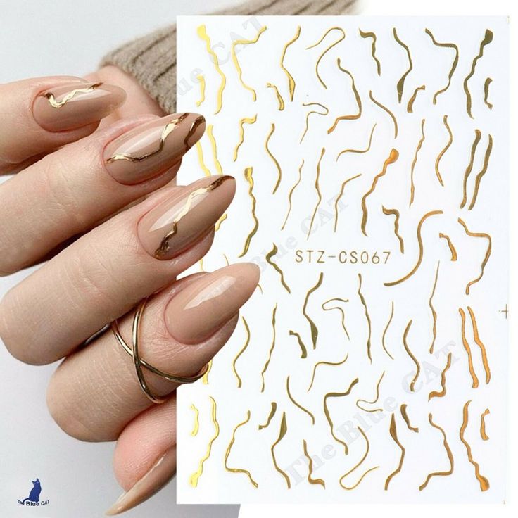 Elegant Nude and Gold Nail Design: A Blend of Contemporary Artistry and Timeless Sophistication.