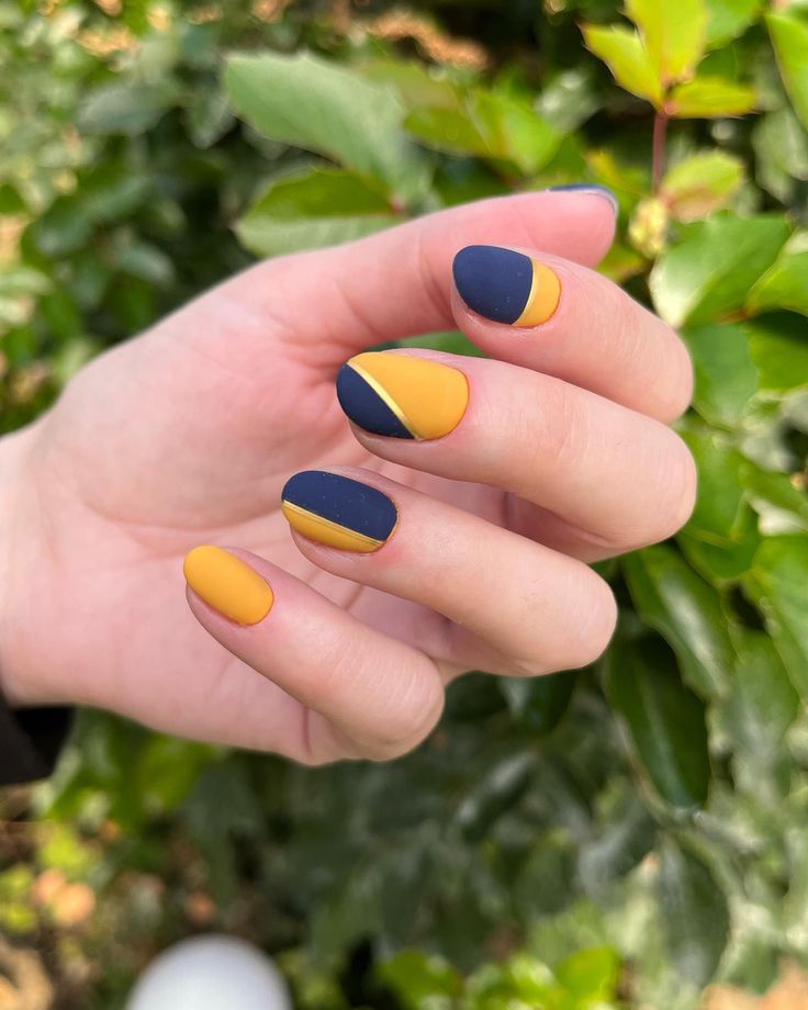 Bold Geometric Nail Design in Navy Blue and Mustard Yellow with Matte Finish for a Modern Look.